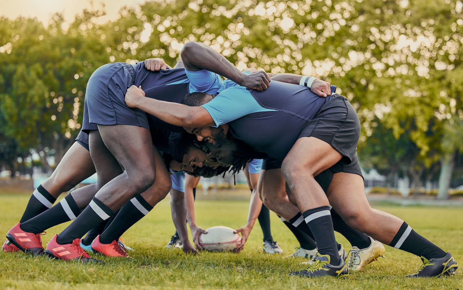 Men playing rugby in a scrum