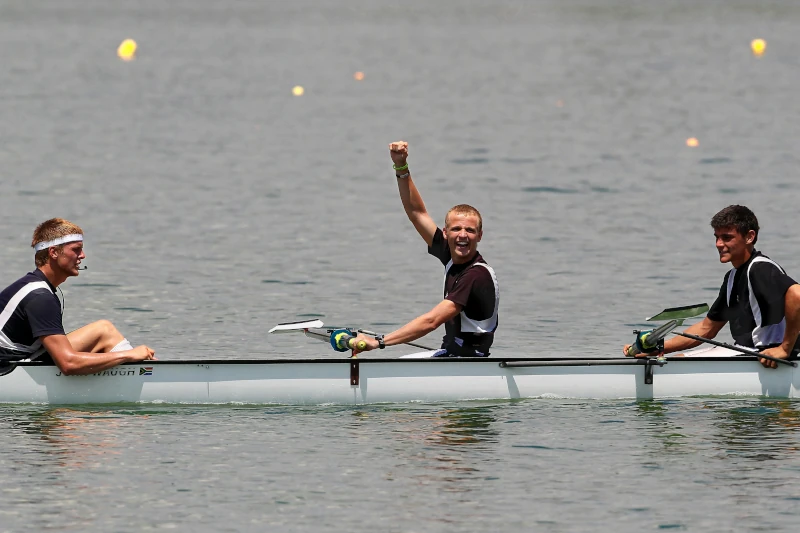 Man celebrating while rowing