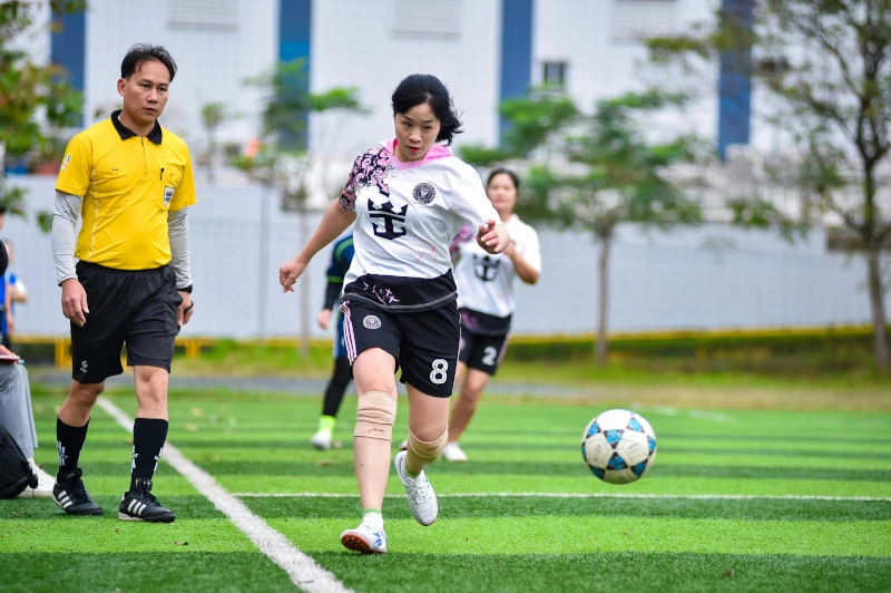 Woman with a soccer ball in a match