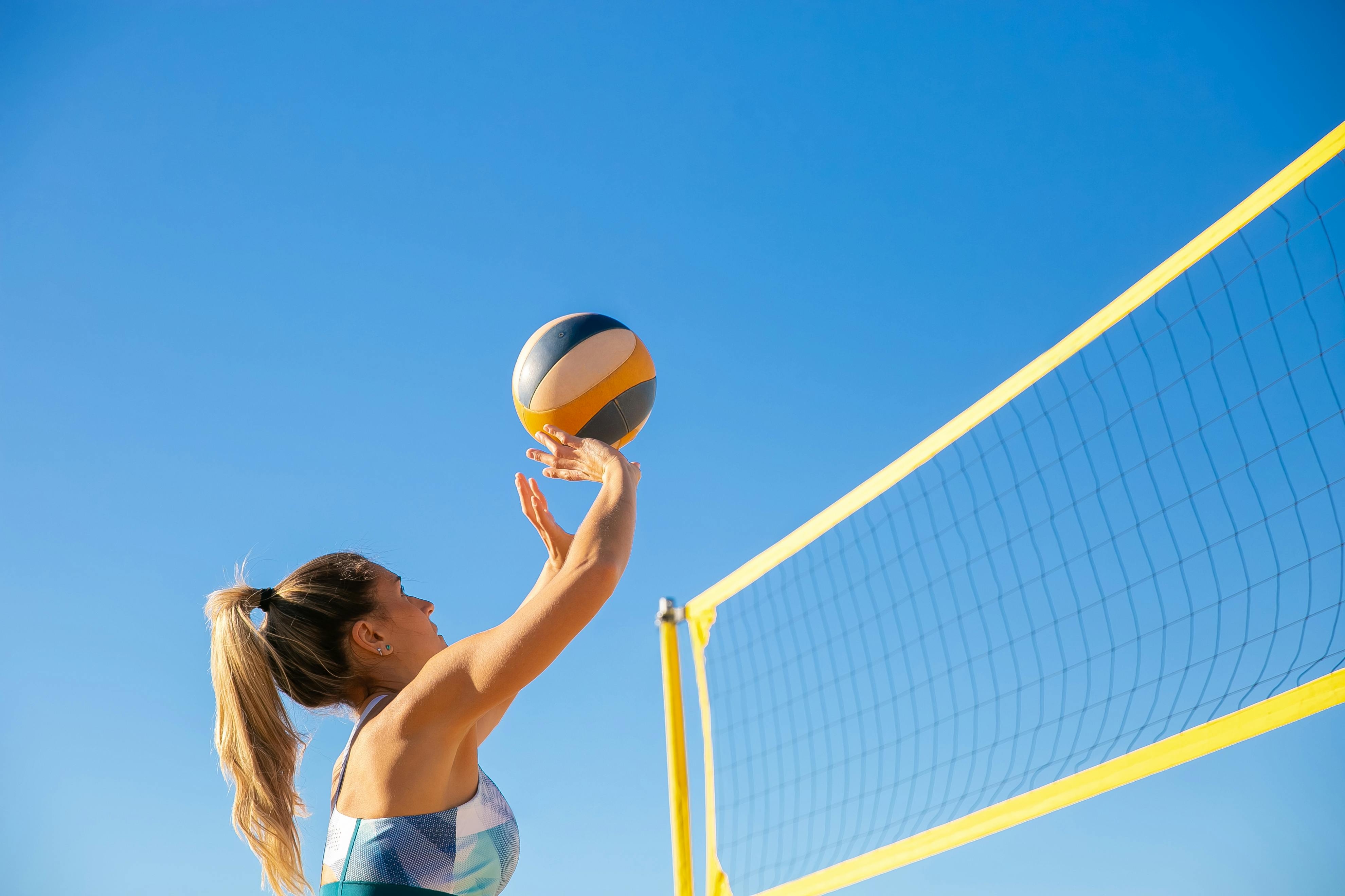 Woman playing a beach volleyball match